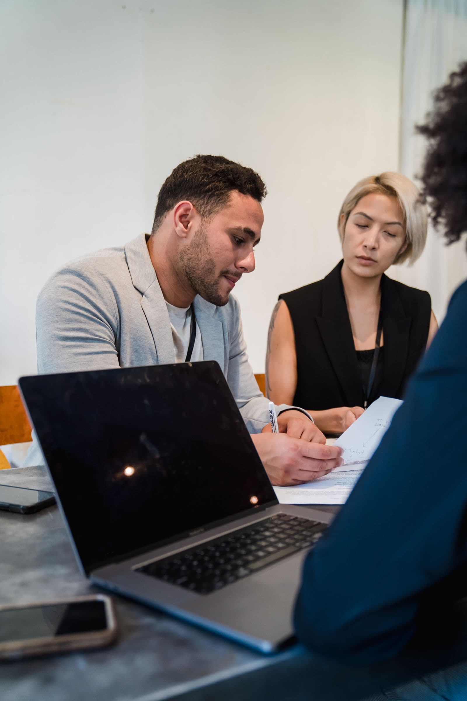 Operations team reviewing documents during a planning session